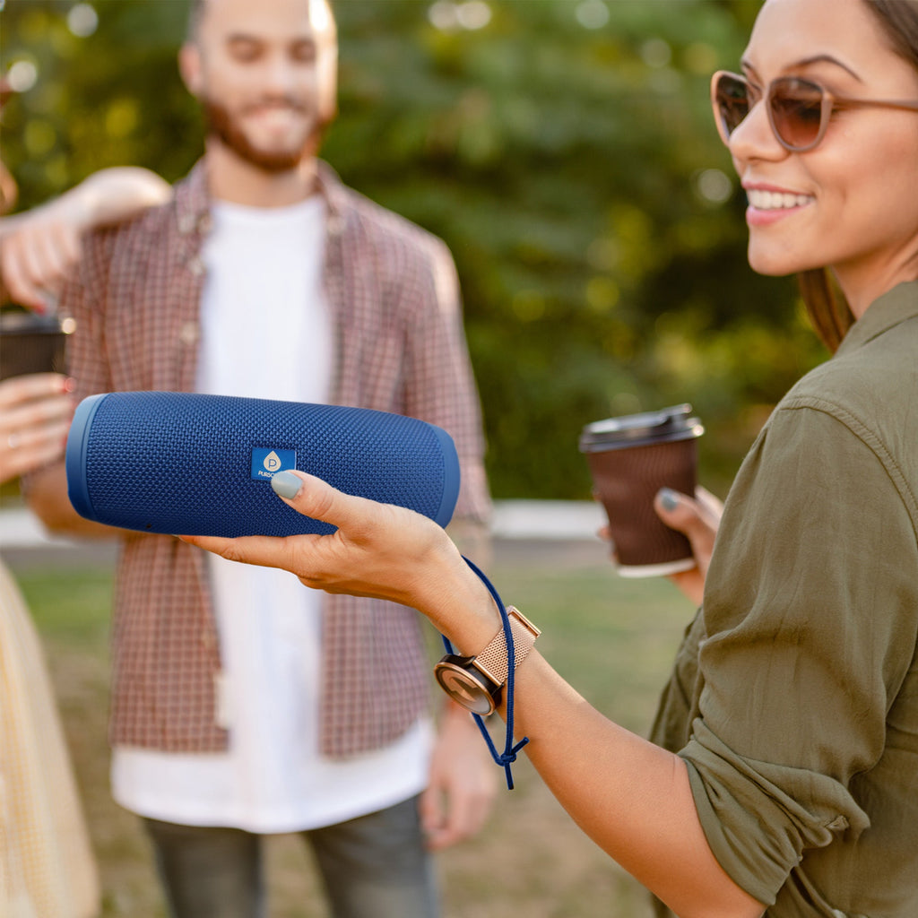 Wireless Pursonic Power Player speaker with black cylindrical design and control buttons on top, compact and portable for music.